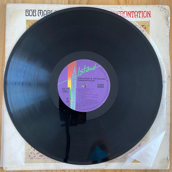 Bob Marley & The Wailers<br>Confrontation 1983 <br>Island Records – 90085-1